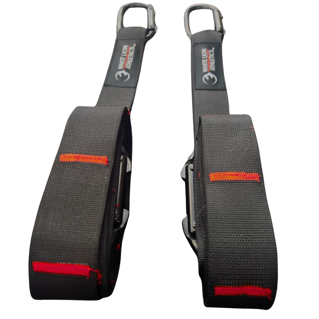 A pair of competition gymnastic straps made of two inch wide,  black heavy duty webbing with heavy duty black carabiners and triple stitched carabiner loops made by White Lion Athletics.