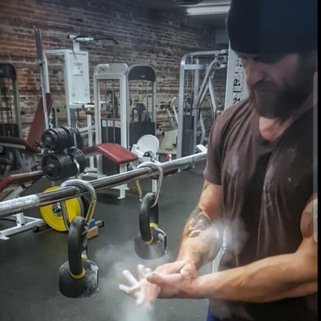 athlete using  best reviewed  gym chalk used for kettlebell training