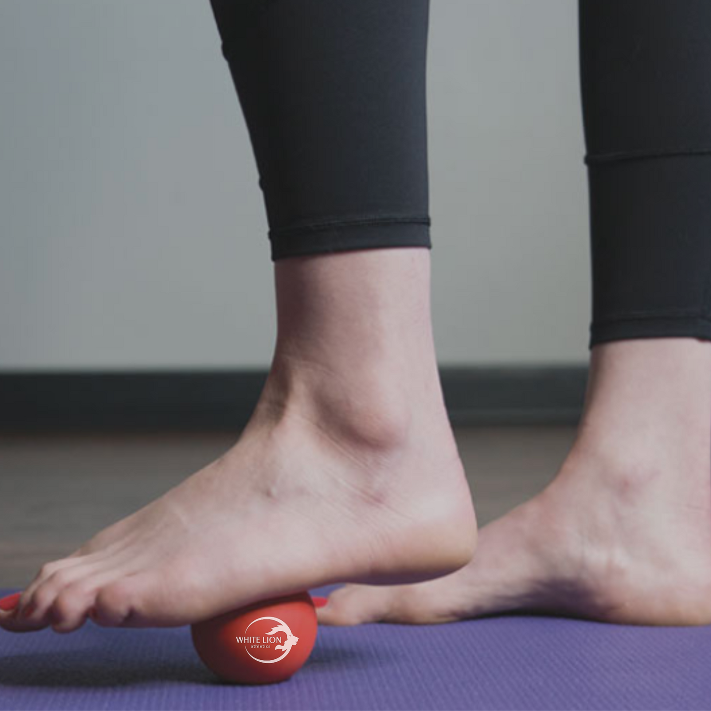 Soft Lacrosse being used for massaging the bottom of the foot.