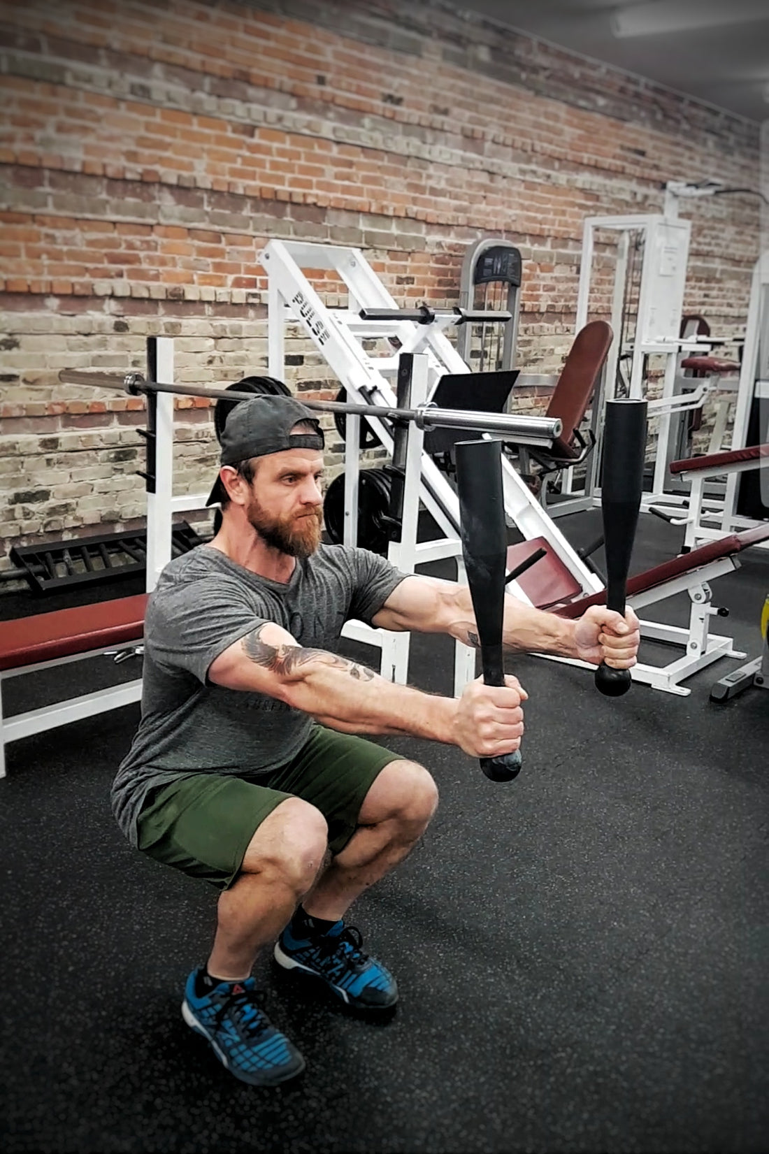Squat Press with 10kg Steel Clubs