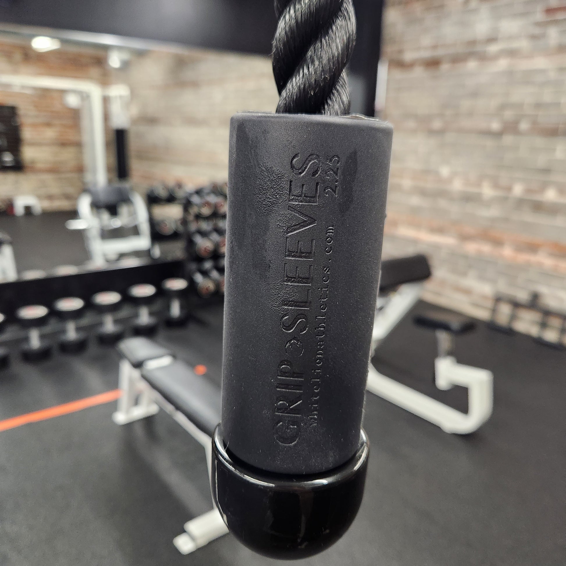 2.25" Grip Sleeves by White Lion Athletics being used on triceps extension rope attachment